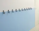 Safe-Coat-Hook-set-of-grey-on-blue-wall-s-1024x830.webp