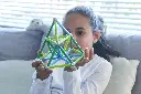 Geomag Classic - Classic - Item 272 - Product Images - Lifestyle - Girl looking at a pyramid that she just finished to build2.webp